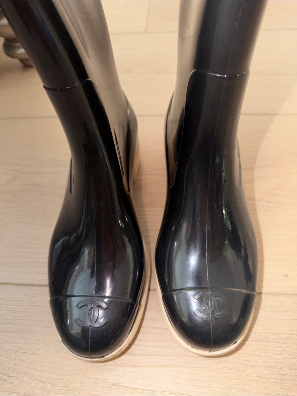 CHANEL Black Rain Boots with Cream Camellia Accent